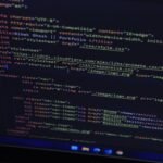 High-resolution close-up of HTML code displayed on a computer screen, perfect for technology themes.