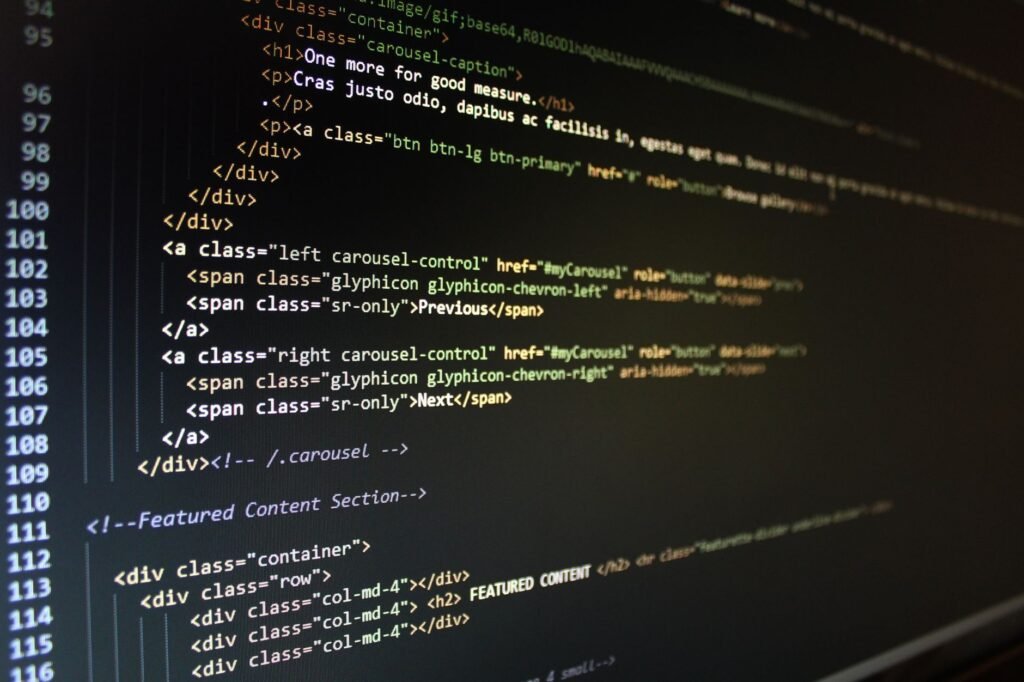Close-up of HTML code displayed on a computer monitor, showcasing web development.