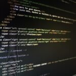 Close-up of HTML code displayed on a computer monitor, showcasing web development.