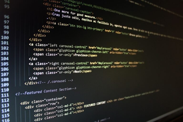 Close-up of HTML code displayed on a computer monitor, showcasing web development.