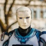 Close-up of a humanoid robot with a futuristic design posing outdoors.
