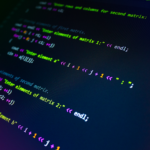 Close-up of colorful programming code displayed on a monitor screen.