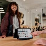 Woman enjoying seamless digital checkout experience in a Berlin clothing store.