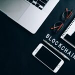 Top view of a modern digital workspace with blockchain theme essentials.