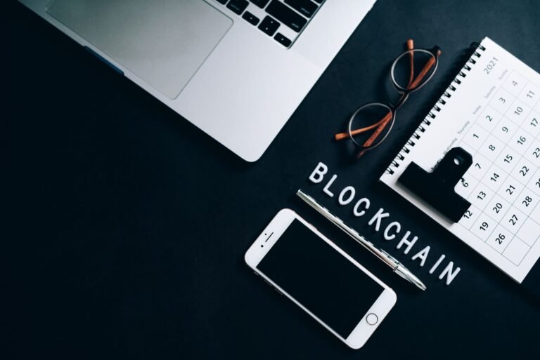 Top view of a modern digital workspace with blockchain theme essentials.