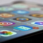 Detailed close-up of smartphone screen displaying various app icons and notifications.