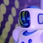 Close-up of a futuristic humanoid robot with a luminescent display in a modern setting.